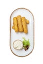 Cheese sticks fried in breadcrumbs. Mozzarella cheese sticks on a plate with sauce and lettuce. Isolate on a white back Royalty Free Stock Photo