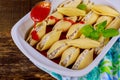 cheese stuffed jumbo pasta shells with marinara sauce served with set on white