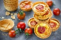 Cheese tomato tartlets , puff pastry appetizers Royalty Free Stock Photo