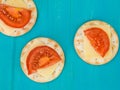 Cheese and Tomato on Water Biscuit Crackers Royalty Free Stock Photo