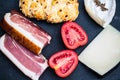 Cheese and Tyrolean bacon on slate, pecorino, french soft cheese Royalty Free Stock Photo