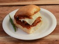 Cheese Vada Pav, Mumbai Famous vada paav is an indian burger. Potato patty is deep fried and stuffed inside a paav or bun like Royalty Free Stock Photo