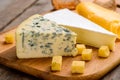 Cheese variety on cutting board Royalty Free Stock Photo