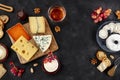Cheese variety. Goat cheese, Brie, blue cheese etc, shot above on a dark background