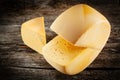 Cheese wheel on wood. Royalty Free Stock Photo