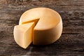 Cheese wheel on wooden table