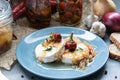 Cheese with white mold Hermelin with onion and hot pepper. Delicious snack Royalty Free Stock Photo