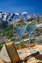 Wine and cake of French Riviera, glasses of cold rose Cote de Provence wine and Tarte Tropezienne cake in yacht harbour of Port