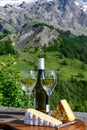 Cheese and wine, glasses of dry white Roussette de Savoie and Vin de Savoie wine from Savoy region, tomme and blue cheese, view on Royalty Free Stock Photo