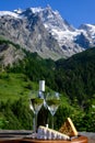 Cheese and wine, glasses of dry white Roussette de Savoie and Vin de Savoie wine from Savoy region, tomme and blue cheese, view on Royalty Free Stock Photo