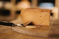 Cheese of wooden table in cheese store. Piese of aged cheese Royalty Free Stock Photo