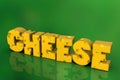 Cheese word written in Swiss yellow cheese letters, on green