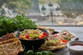 Cheese and zucchini tortillas, smoked salmon, radishes, cherry tomatoes, avocado cream, cream cheese, tomato cream with basil, par