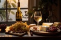 Cheeseboard with assorted cheese, grape near wineglass with white wine on table near window