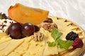 Cheeseboard: cheese and fruits
