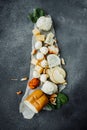 Cheeseboard with different types of cheeses: mozzarella, Georgian, cottage cheese, smoked, parmesan, spicy, hard varieties. fresh