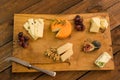 Cheeseboard with fruit and herbs