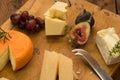 Cheeseboard with fruit and herbs