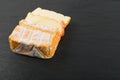 Cheeseboard with Sliced Yellow Cheese Close Up Royalty Free Stock Photo