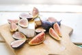 Cheese board with figs on white