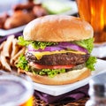 Cheeseburger with beer and french fries close up Royalty Free Stock Photo