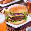 Cheeseburger with beer and french fries Royalty Free Stock Photo