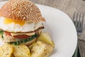 Cheeseburger with fried egg and potato vedges Royalty Free Stock Photo