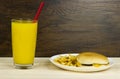 Cheeseburger orange juice healthy food junk food fast food food cheese meat loaf bread wood background