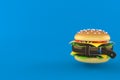 Cheeseburger squeezed by belt Royalty Free Stock Photo