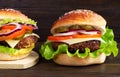 Cheeseburger on a wooden background. Hamburger with cheese. Burger isolated. Tasty Dinner.Copy space