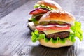 Cheeseburger on a wooden background. Hamburger with cheese. Burger isolated. Tasty Dinner.Copy space