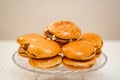 cheeseburgers on a round glass dish. fast food. original cake.