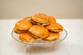 cheeseburgers on a round glass dish. fast food. original cake.