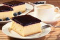Cheesecak with blueberries and a cap of coffee Royalty Free Stock Photo