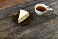 Cheesecake with coffee on a dark wooden background. view from above. A cheesecake next to it on a brown wooden background. retro Royalty Free Stock Photo