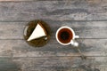 Cheesecake with coffee on a dark wooden background. view from above. A cheesecake next to it on a brown wooden background. retro Royalty Free Stock Photo