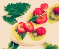 Cheesecake with fresh fruits, insta-retro effect, close-up