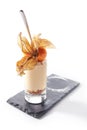 Cheesecake in high glass decorated with physalis