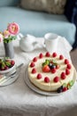 Cheesecake, homemade cake with strawberry berries in a gray plate. Concept of sweet festive food