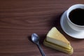 Cheesecake with hot coffee on a dark wooden table and copy space Royalty Free Stock Photo