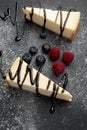 Cheesecake with liquorice sauce and fruits Royalty Free Stock Photo