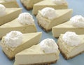 Cheesecake pattern, servings of cheesecake on a blue background top view