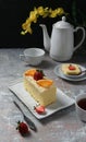 Cheesecake with a sprinkling of grated cheese, orange slices and strawberry pieces Royalty Free Stock Photo