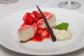 Cheesecake with Strawberries Chocolate and Mint Leaf Royalty Free Stock Photo