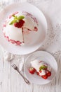Cheesecake with strawberries on a plate close up. vertical top v Royalty Free Stock Photo