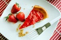 A slice of cheesecake with strawberry jelly Royalty Free Stock Photo