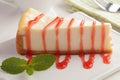 Cheesecake under strawberry sauce Royalty Free Stock Photo