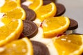 Cheesecakes Decorated with Orange Slices and Chocolate Pieces Royalty Free Stock Photo