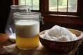 cheesecloth draining whey from fresh curds
