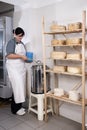 Cheesemaker pours rennet Royalty Free Stock Photo